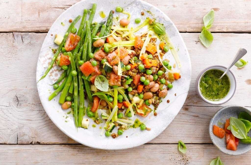 Barley, quinoa and spelt with vegetables and basil oil